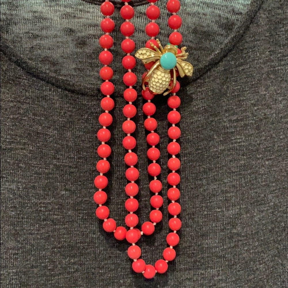 Beaded necklace with bumble bee brooch.